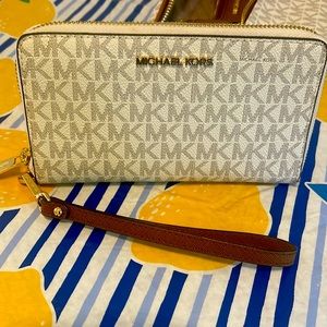 Michael Kors Wristlet and phone holder.